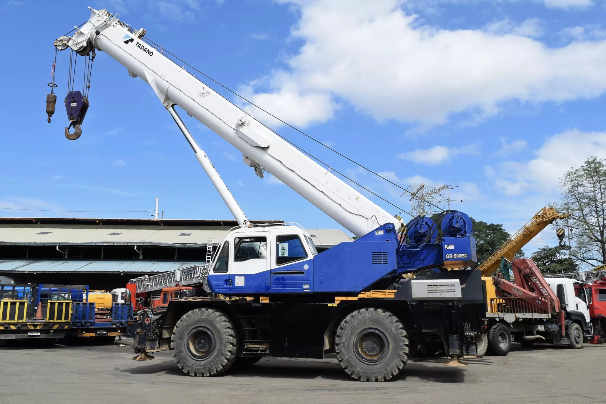 A large blue Tadano crane out for routine resting in the Guzent equipment yard.