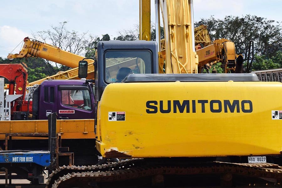 A Sumitomo backhoe parked in Guzent's equipment yard.