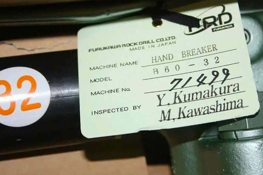A Furukawa jack hammer hand breaker with its original tag.