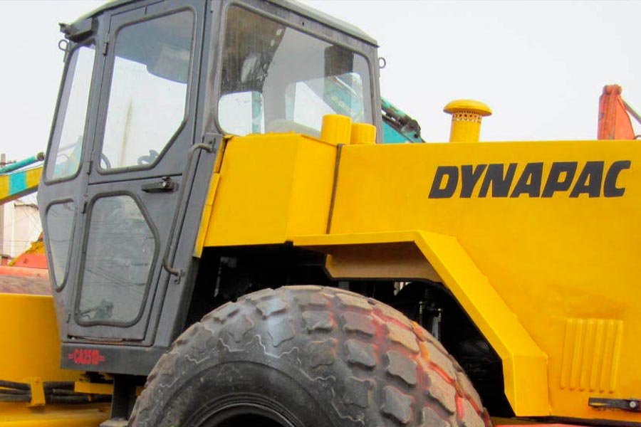 A Dynapac road roller or vibratory compactor at Guzent's equipment yard.
