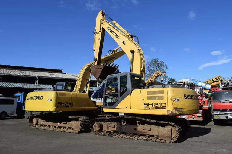 Two Sumitomo backhoes being tested at Guzent's equipment yard.
