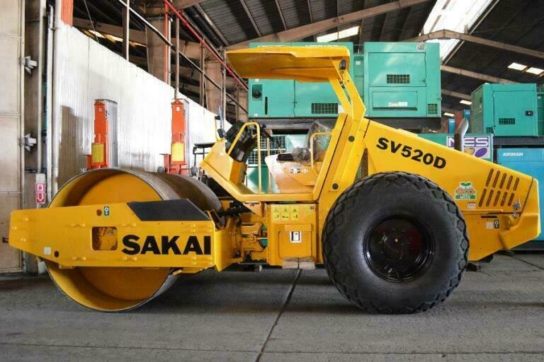 A Sakai road roller at Guzent's equipment yard.